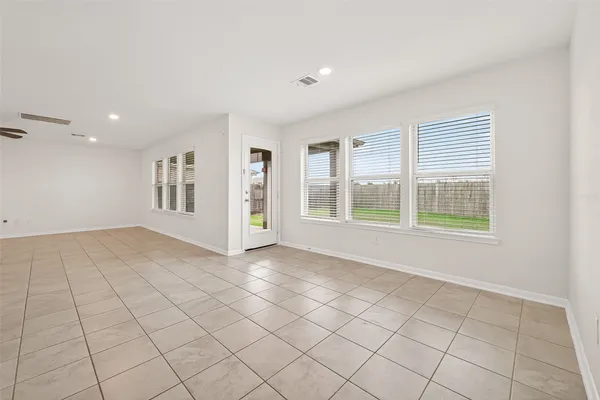 a view of a kitchen with a sink and a refrigerator