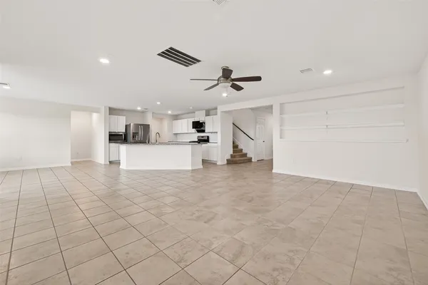 a kitchen with stainless steel appliances granite countertop a sink and a stove
