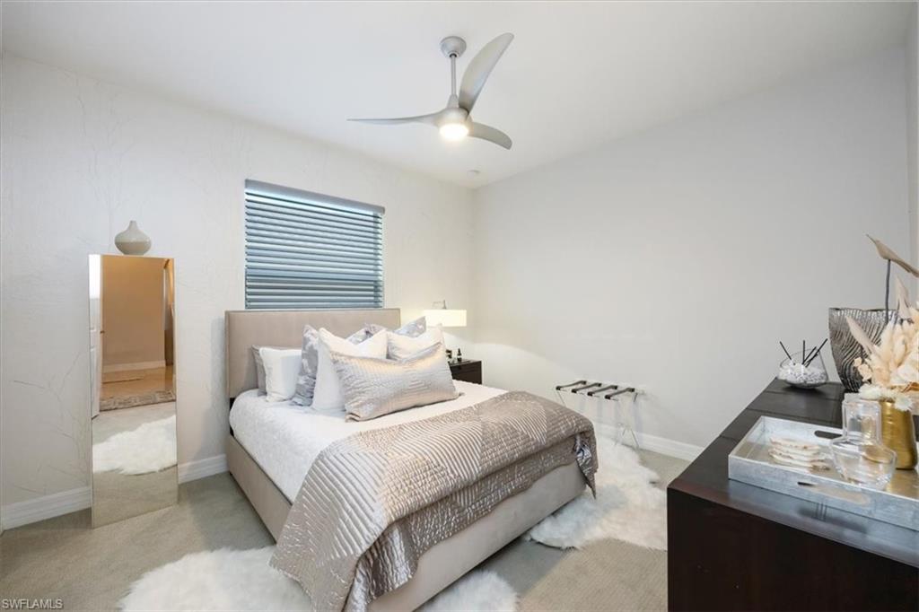 13539 Mandarin Circle Naples, FL 34109 - Photo 21 of 42 a bedroom with a bed and with furniture