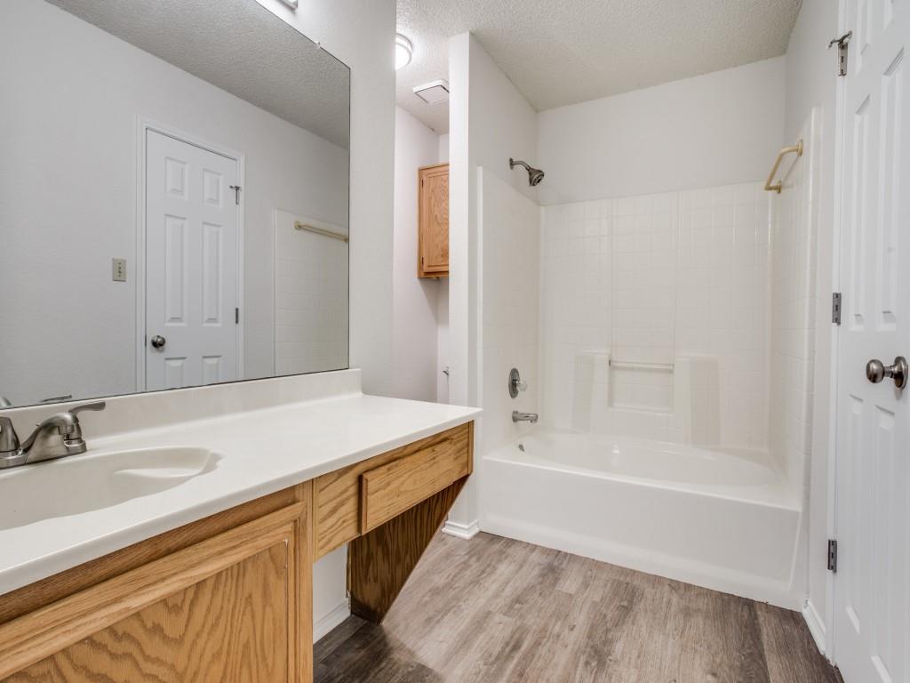 2097 Quarter Horse Lane Keller, TX 76248 - Photo 12 of 16 a bathroom with a tub sink and mirror