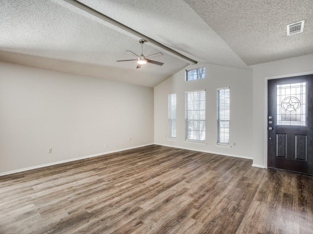 2097 Quarter Horse Lane Keller, TX 76248 - Photo 2 of 16 an empty room with wooden floor and windows
