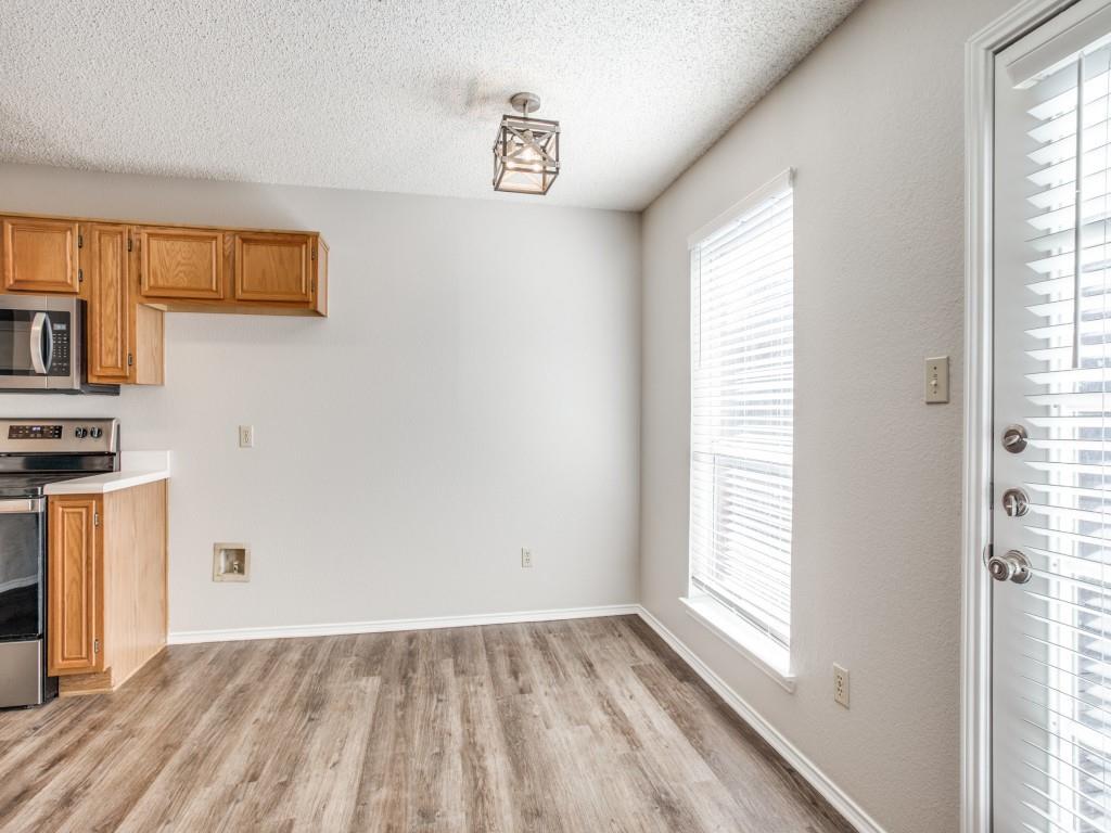 2097 Quarter Horse Lane Keller, TX 76248 - Photo 5 of 16 a view of a kitchen with wooden floor and electronic appliances
