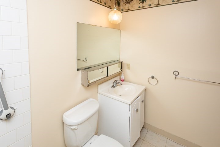 11 Shadowbrook Lane, Unit 9 Milford, MA 01757 - Photo 14 of 20 a view of bathroom with a toilet sink and mirror