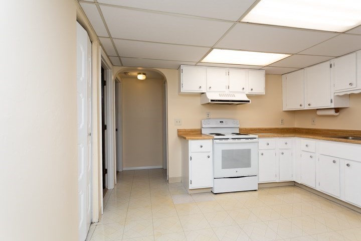 11 Shadowbrook Lane, Unit 9 Milford, MA 01757 - Photo 8 of 20 a kitchen with stainless steel appliances granite countertop a stove a sink and a refrigerator