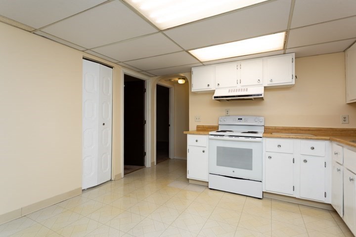11 Shadowbrook Lane, Unit 9 Milford, MA 01757 - Photo 9 of 20 a kitchen with stainless steel appliances granite countertop a stove and a refrigerator