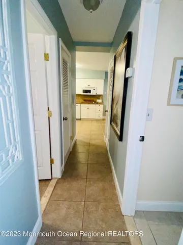 a bedroom with a bed and a night stand