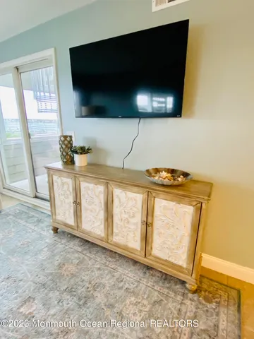 a roof deck with a table and chairs