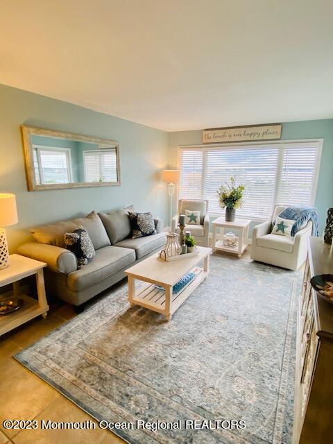 438 Highway 35, Unit 5305 Mantoloking, NJ 08738 - Photo 4 of 19 a living room with furniture and a window