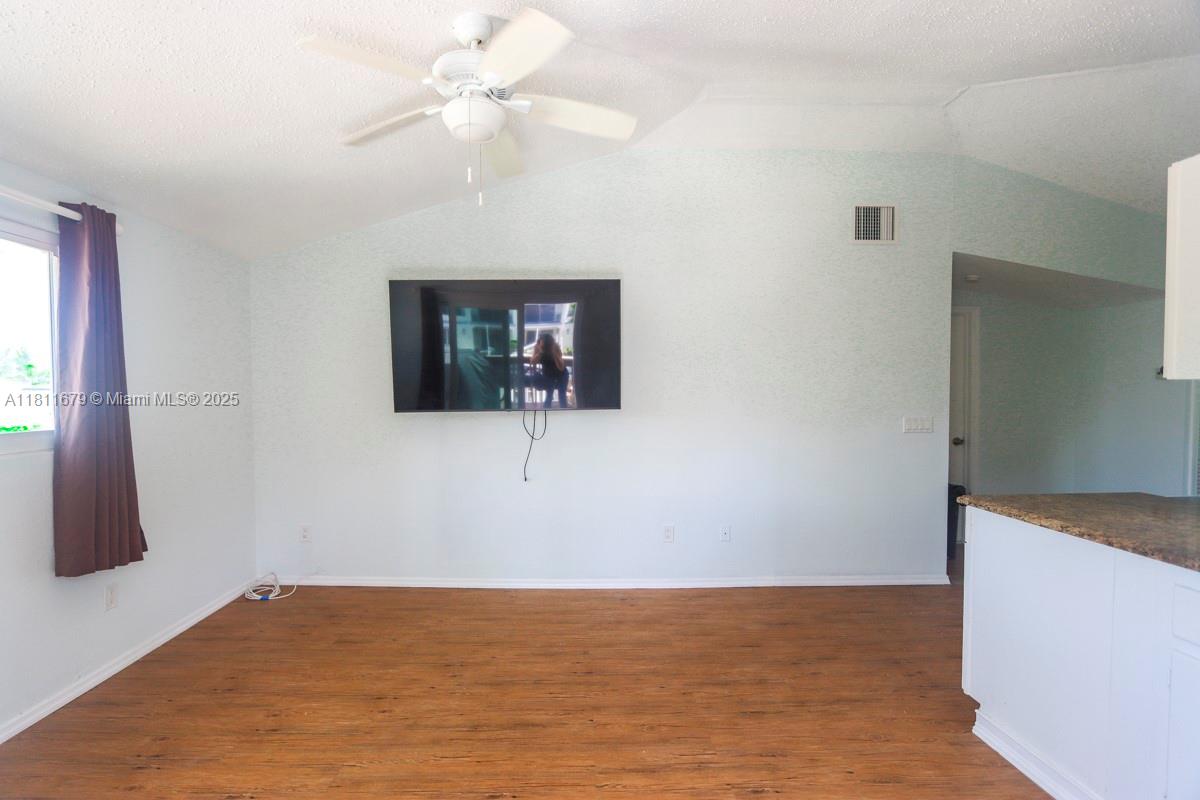812 Chukker Road, Unit 3 Delray Beach, FL 33483 - Photo 15 of 20 a view of a livingroom with a flat screen tv