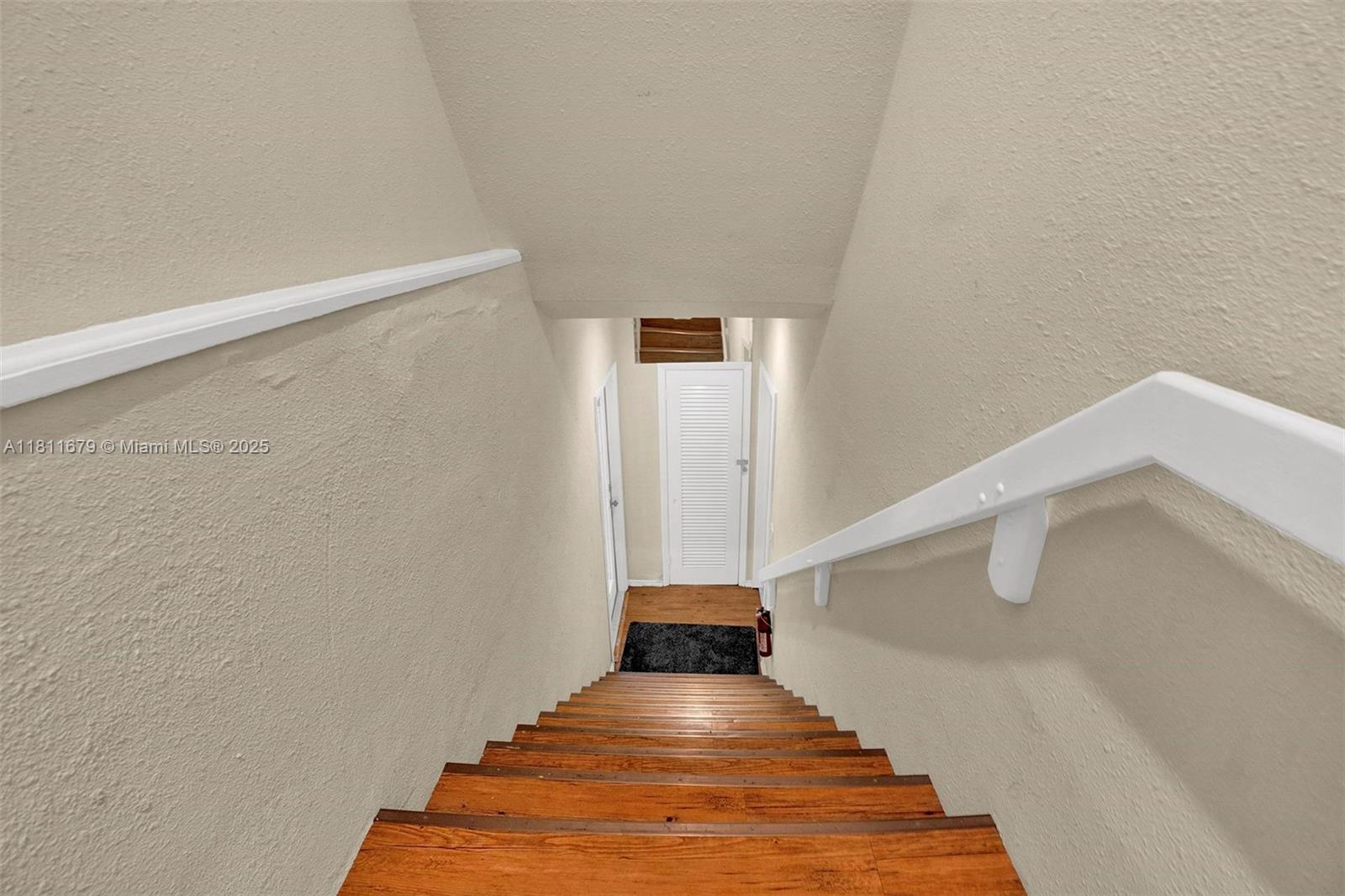 812 Chukker Road, Unit 3 Delray Beach, FL 33483 - Photo 17 of 20 a view of a hallway with staircase