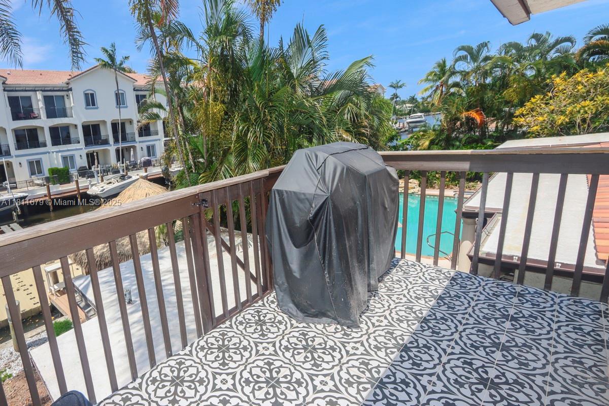 812 Chukker Road, Unit 3 Delray Beach, FL 33483 - Photo 4 of 20 a view of a balcony with wooden floor