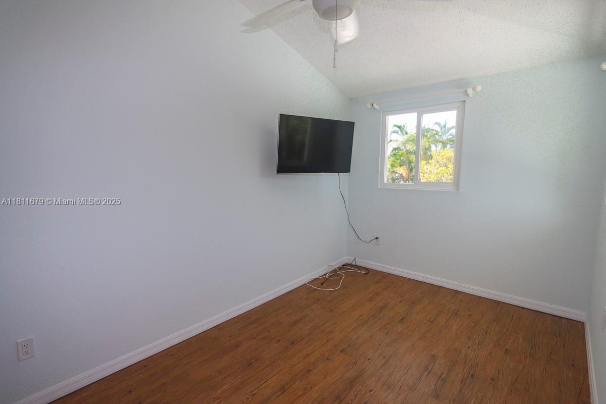 812 Chukker Road, Unit 3 Delray Beach, FL 33483 - Photo 10 of 20 wooden floor in an empty room with a window