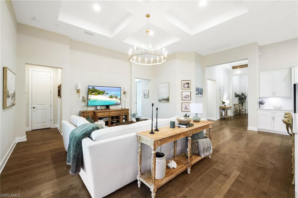 19837 Beverly Park Road Estero, FL 33928 - Photo 12 of 39 a living room with furniture and a chandelier