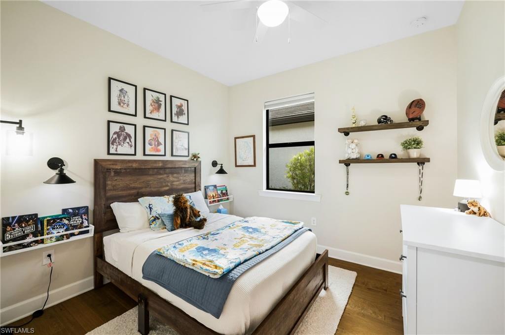 19837 Beverly Park Road Estero, FL 33928 - Photo 20 of 39 a bedroom with a bed and a dresser