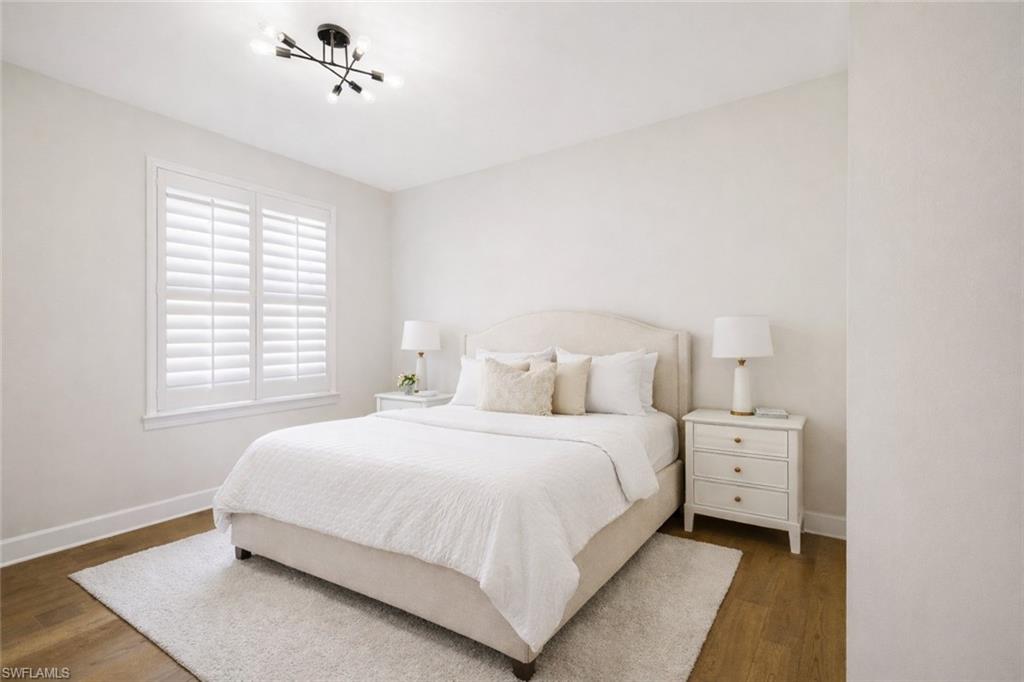 19837 Beverly Park Road Estero, FL 33928 - Photo 23 of 39 a bedroom with a bed and a window