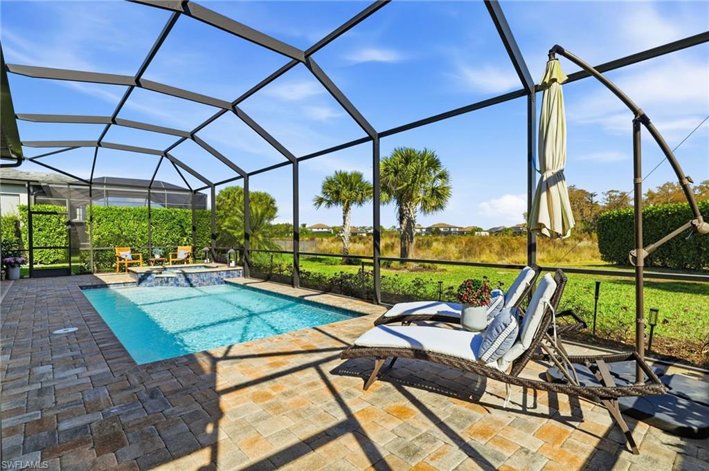 19837 Beverly Park Road Estero, FL 33928 - Photo 33 of 39 a view of swimming pool with a patio