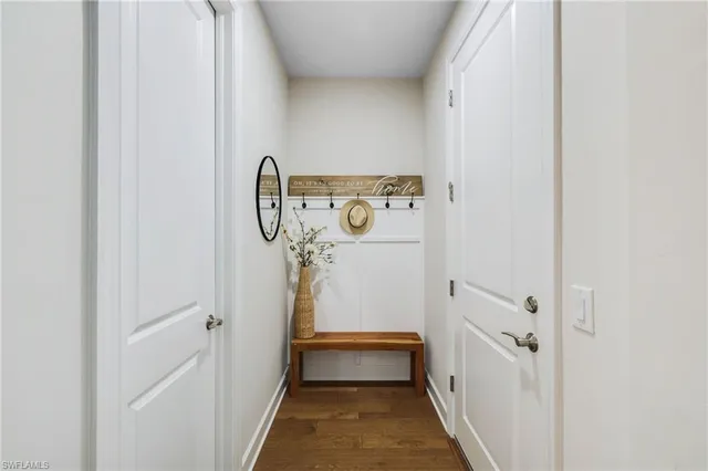 a kitchen with kitchen island stainless steel appliances a sink and living room view