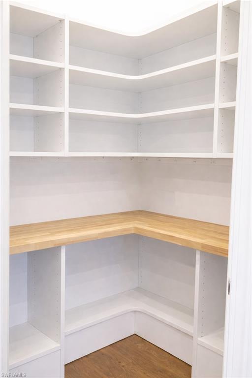 19837 Beverly Park Road Estero, FL 33928 - Photo 10 of 39 a view of walk in closet with empty racks