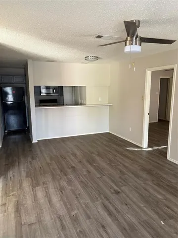 a view of a house with backyard porch and sitting area