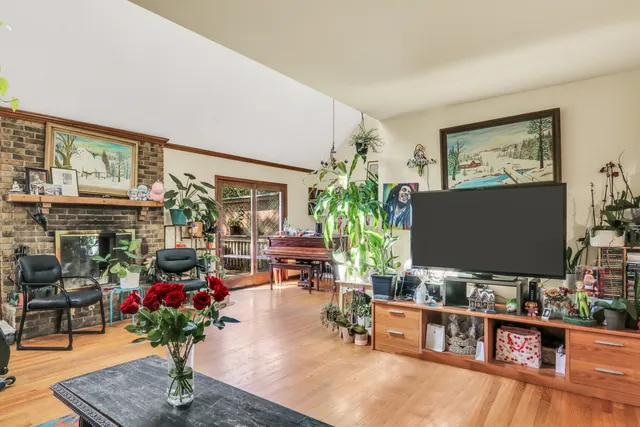 a living room with furniture and flowers