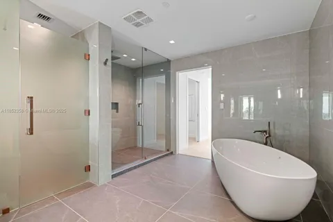 a view of a refrigerator in kitchen and wooden floor