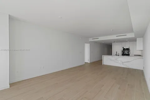 a view of white house with a yard