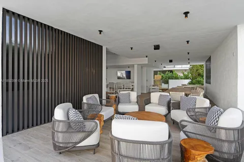 a view of a swimming pool with a lounge chairs