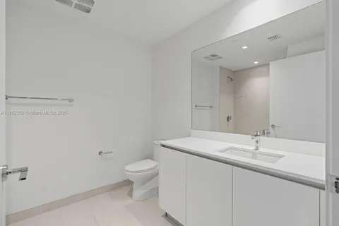 a kitchen with stainless steel appliances granite countertop a stove and a refrigerator