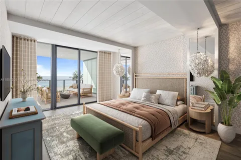 a bedroom with a balcony a bed and a couch