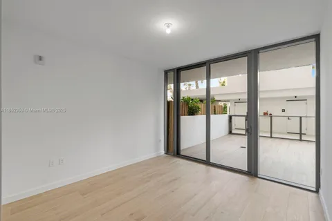 a view of swimming pool with outdoor seating and palm trees