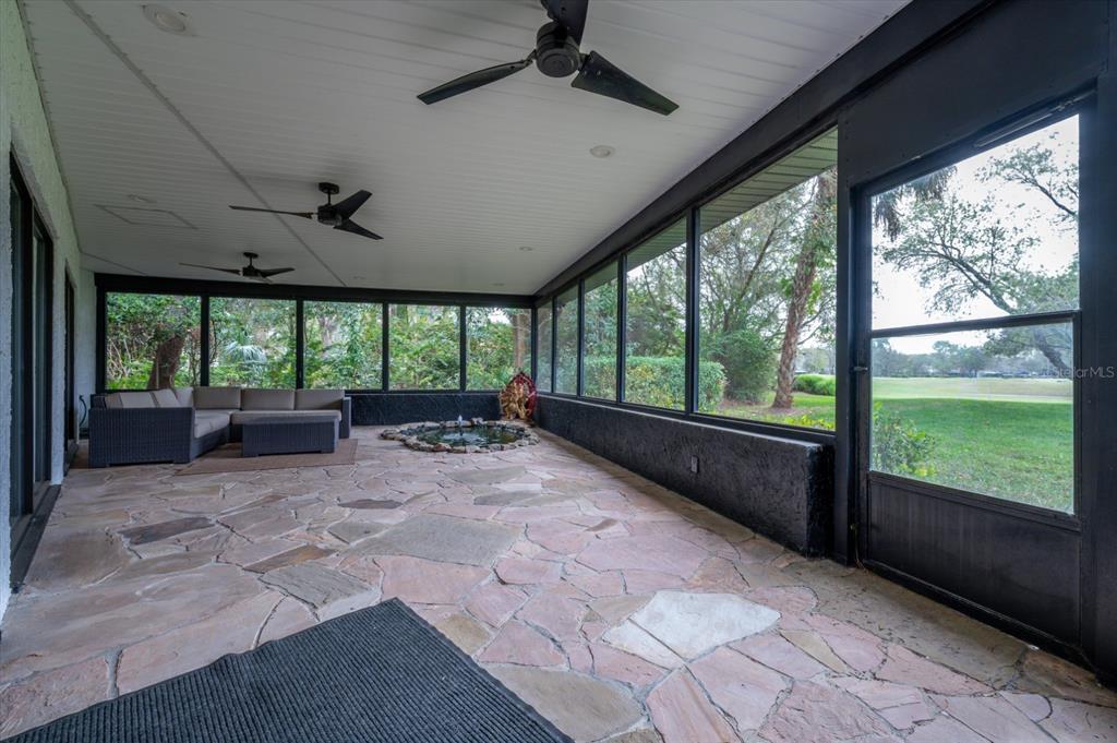 29318 Whippoorwill Lane Wesley Chapel, FL 33543 - Photo 28 of 38 a view of a patio with a garden