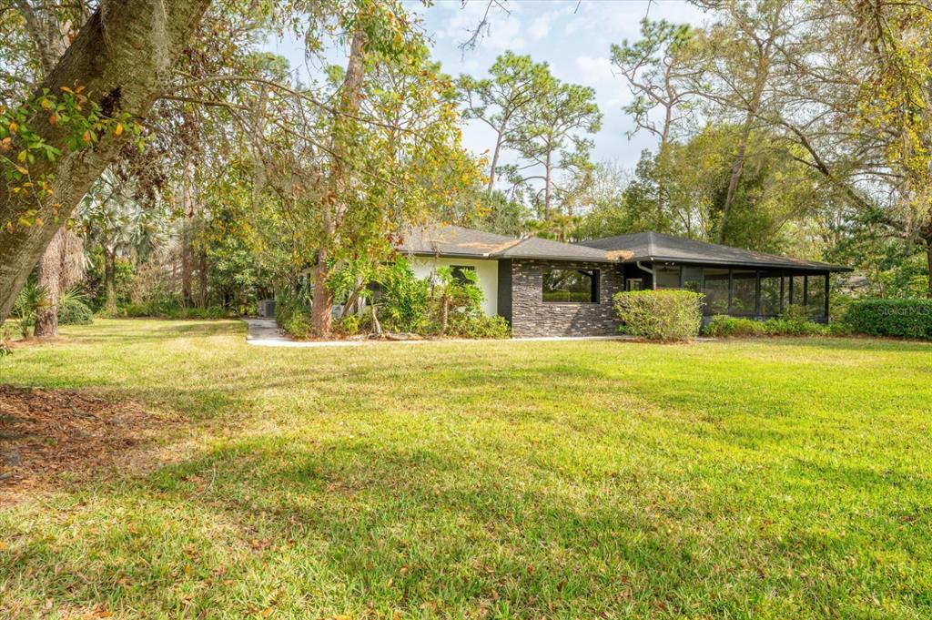 29318 Whippoorwill Lane Wesley Chapel, FL 33543 - Photo 32 of 38 a view of a house with a swimming pool
