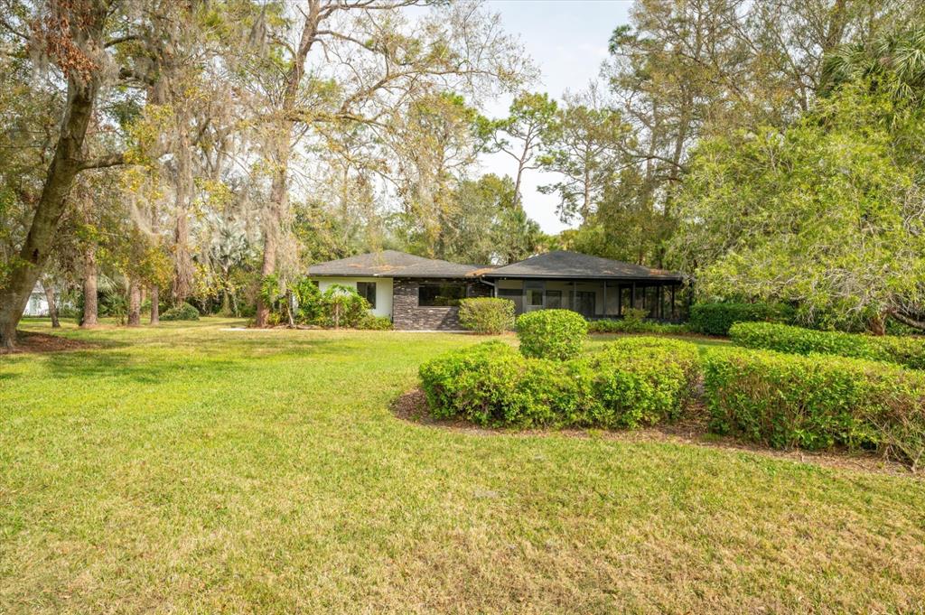 29318 Whippoorwill Lane Wesley Chapel, FL 33543 - Photo 33 of 38 a front view of a house with a yard