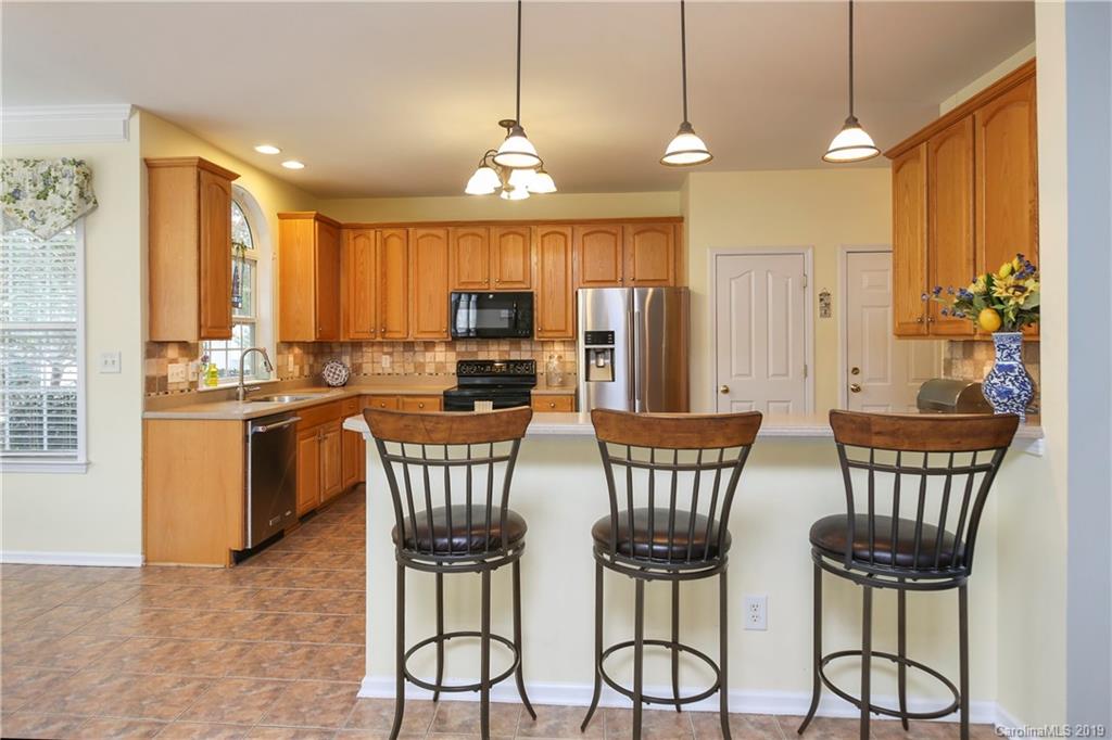 4707 Lapis Court Fort Mill, SC 29708 - Photo 14 of 40 a view of a dining room with furniture window and outside view