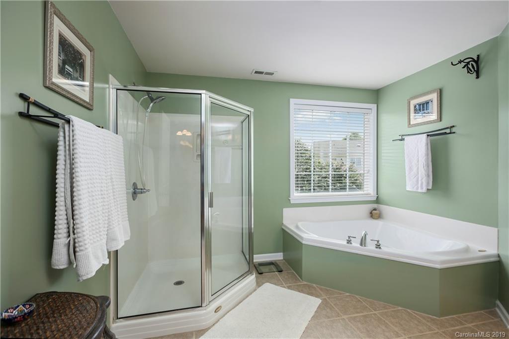4707 Lapis Court Fort Mill, SC 29708 - Photo 22 of 40 a bathroom with a bathtub and shower