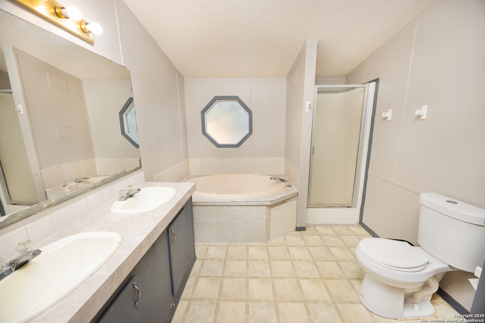 808 Uvalde Street Pleasanton, TX 78064 - Photo 13 of 25 a bathroom with a sink toilet and shower