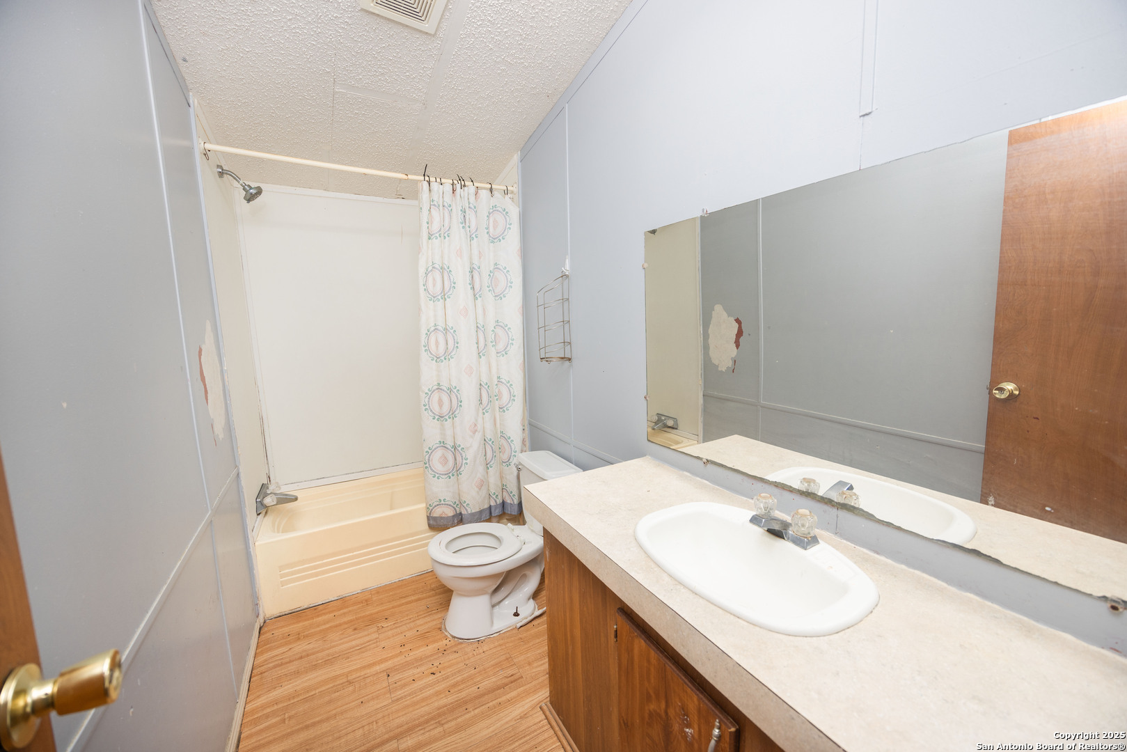 808 Uvalde Street Pleasanton, TX 78064 - Photo 14 of 25 a bathroom with a sink toilet and shower