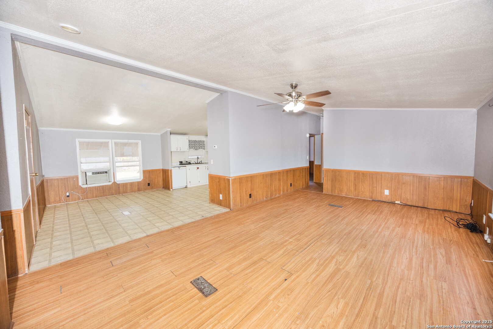 808 Uvalde Street Pleasanton, TX 78064 - Photo 6 of 25 a view of a living room with wooden floor