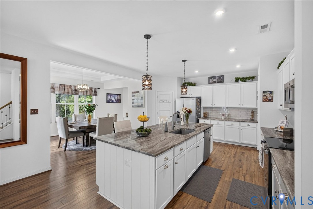 7507 Rouseaux Circle Chesterfield, VA 23832 - Photo 14 of 37 Kitchen featuring a large central island, pendant