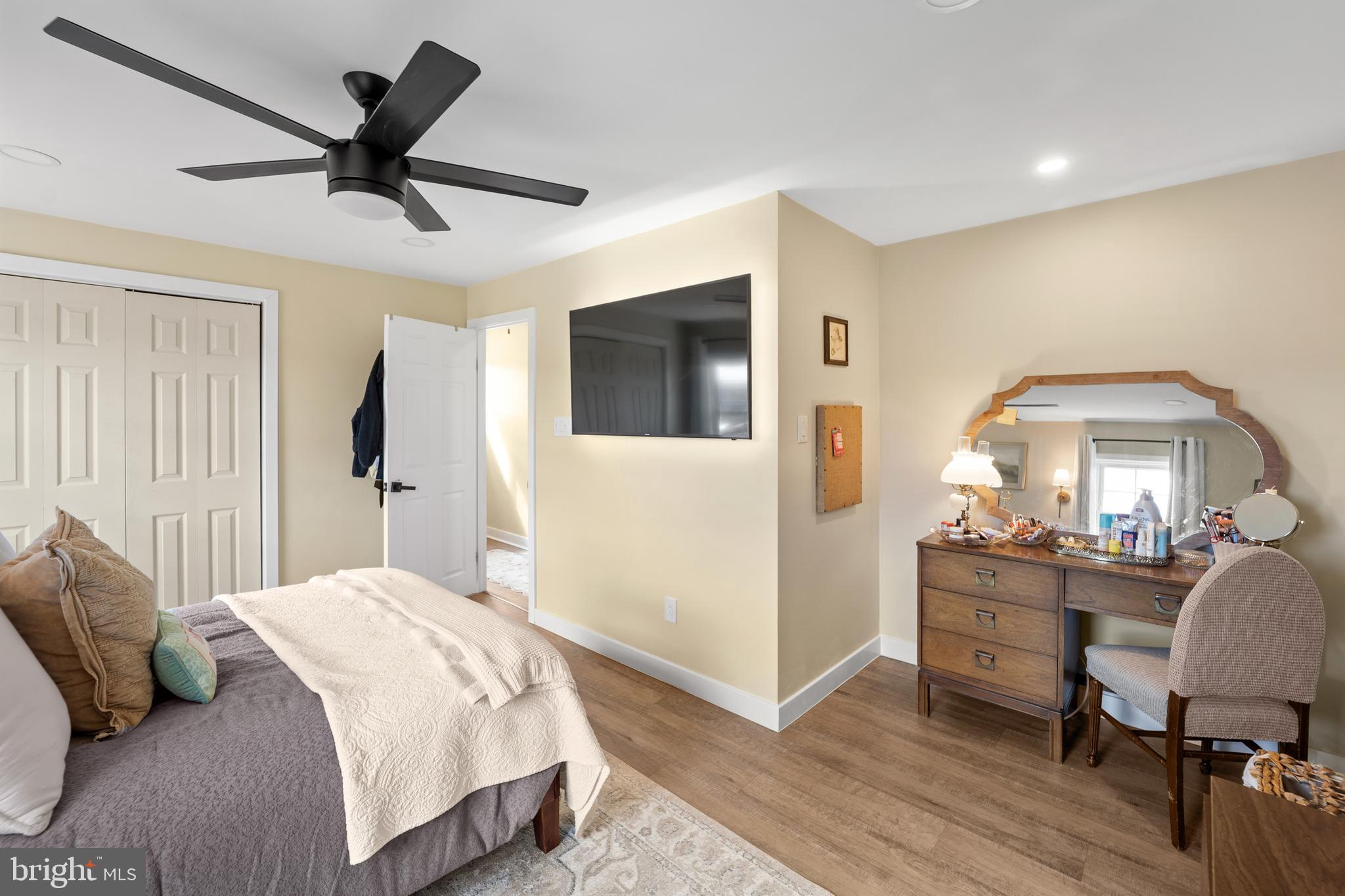 1012 Mearns Road Warminster, PA 18974 - Photo 16 of 28 a bedroom with a bed and a chandelier