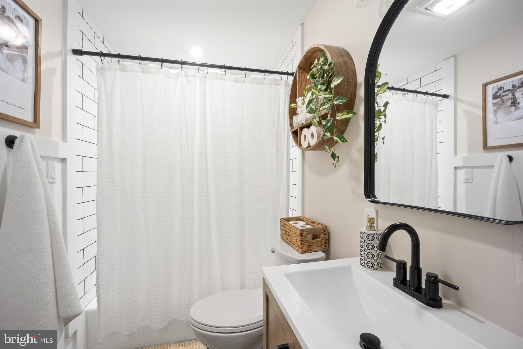 1012 Mearns Road Warminster, PA 18974 - Photo 17 of 28 a bathroom with a sink a toilet and a mirror