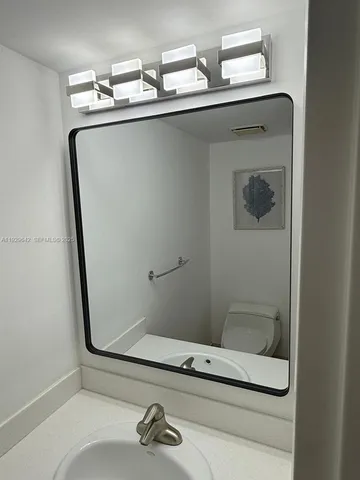 a kitchen with a stove and a refrigerator