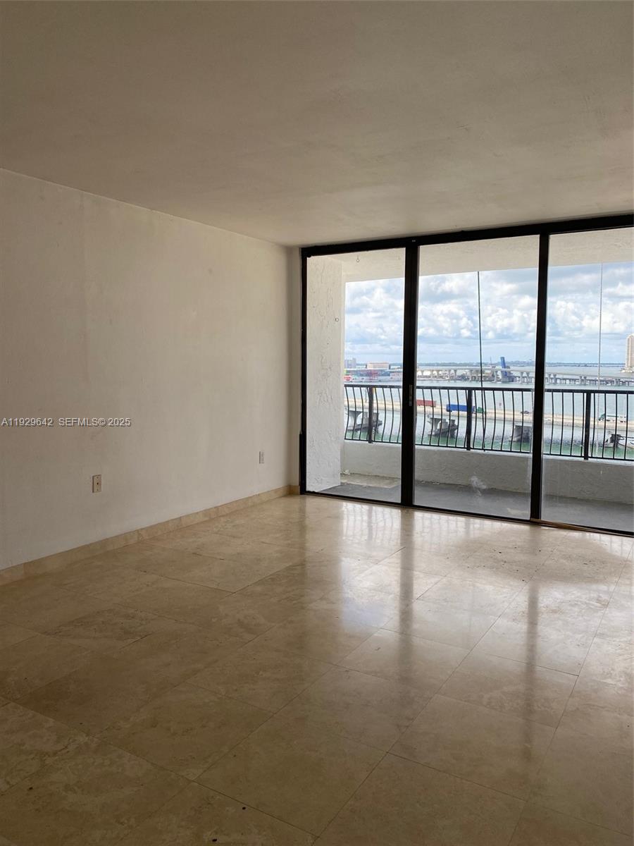 555 Northeast 15th Street, Unit 14K Miami, FL 33132 - Photo 23 of 47 a view of an empty room with a floor to ceiling window