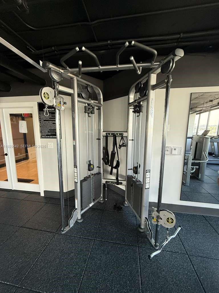 555 Northeast 15th Street, Unit 14K Miami, FL 33132 - Photo 38 of 47 a view of a room with gym equipment