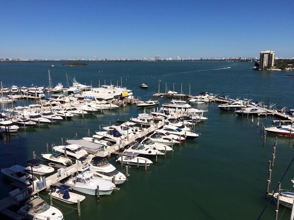 555 Northeast 15th Street, Unit 14K Miami, FL 33132 - Photo 4 of 47 a view of a ocean with boats and trees in the background
