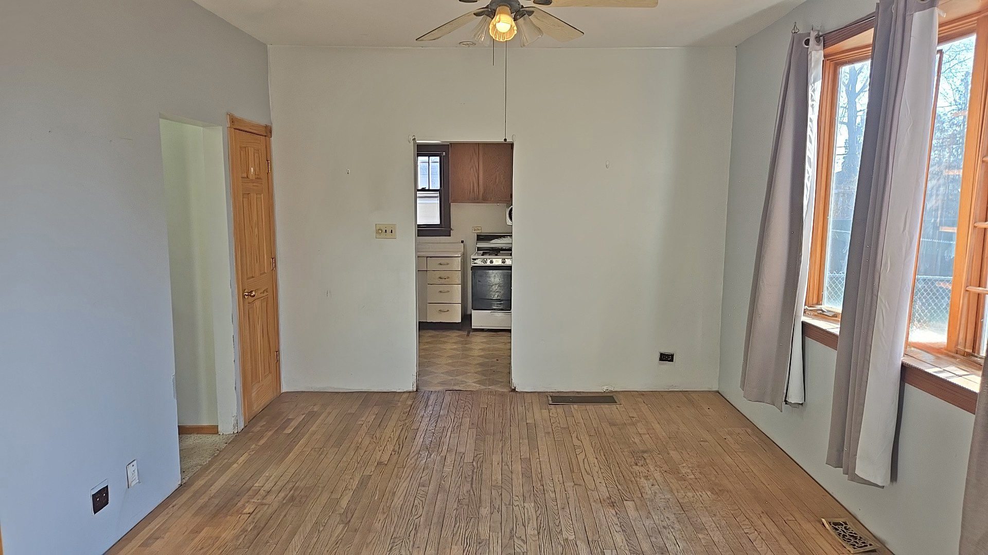 3417 Butler Avenue Steger, IL 60475 - Photo 8 of 22 wooden floor in an empty room with a window