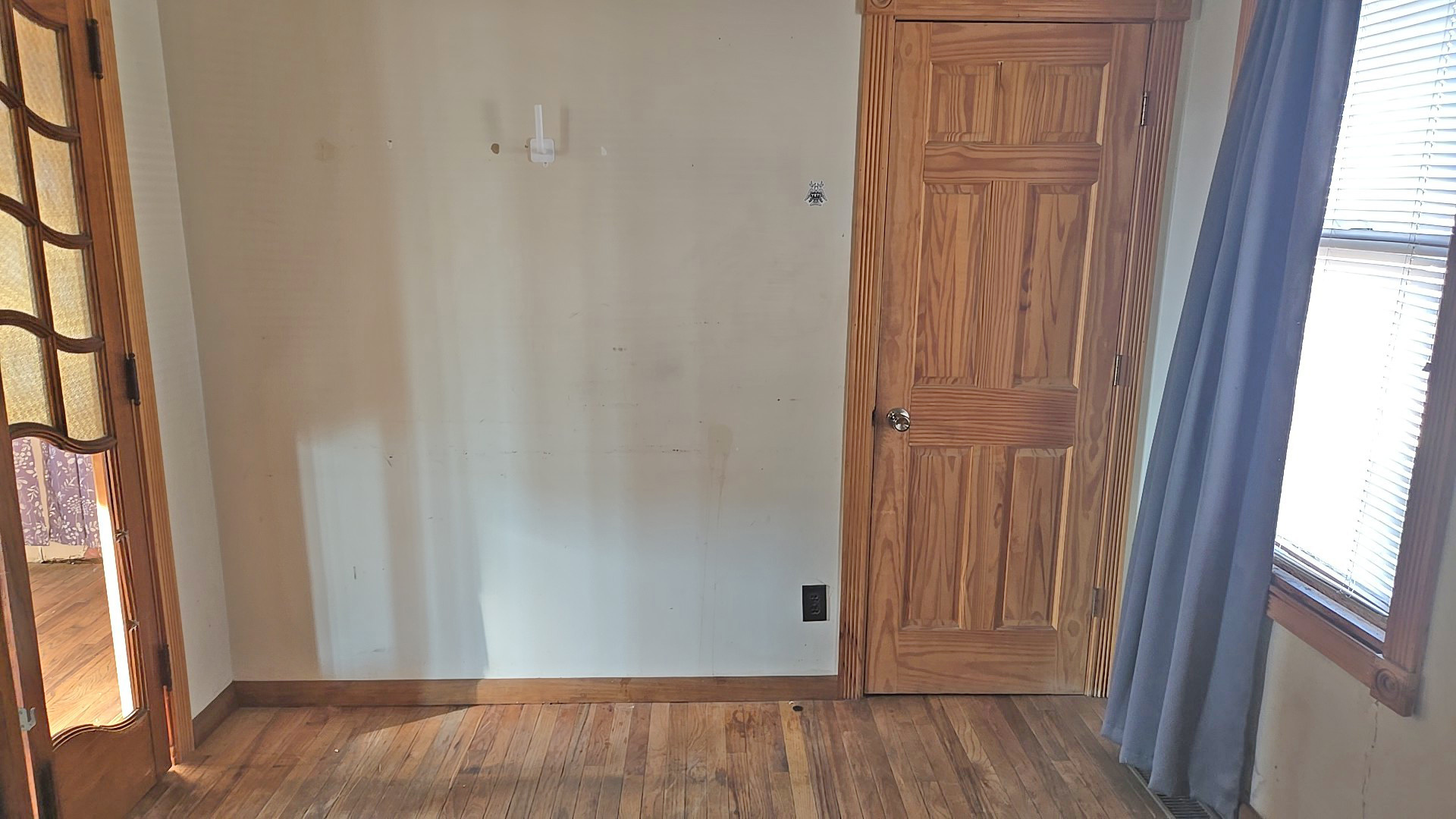 3417 Butler Avenue Steger, IL 60475 - Photo 10 of 22 an empty room with wooden floor and windows