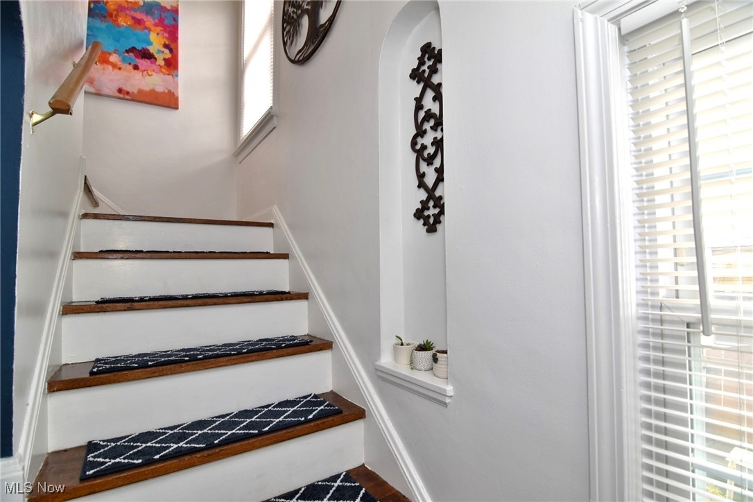 3921 Grosvenor Road Cleveland, OH 44118 - Photo 26 of 46 Staircase with arched walkways and baseboards