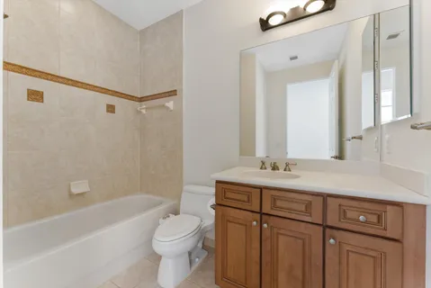 a bathroom with a sink a toilet and a bathtub