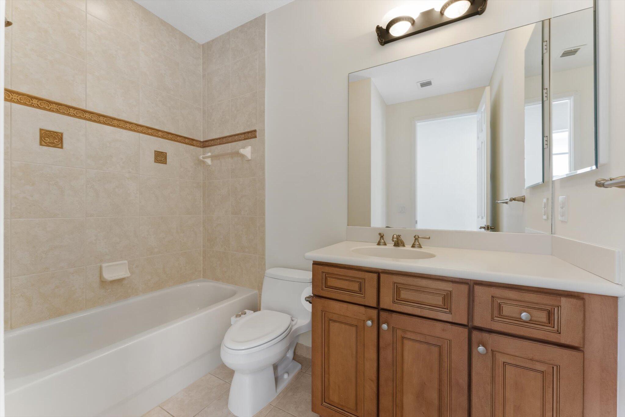 806 Northwest 83rd Lane Boca Raton, FL 33487 - Photo 20 of 37 a bathroom with a sink a toilet and a bathtub
